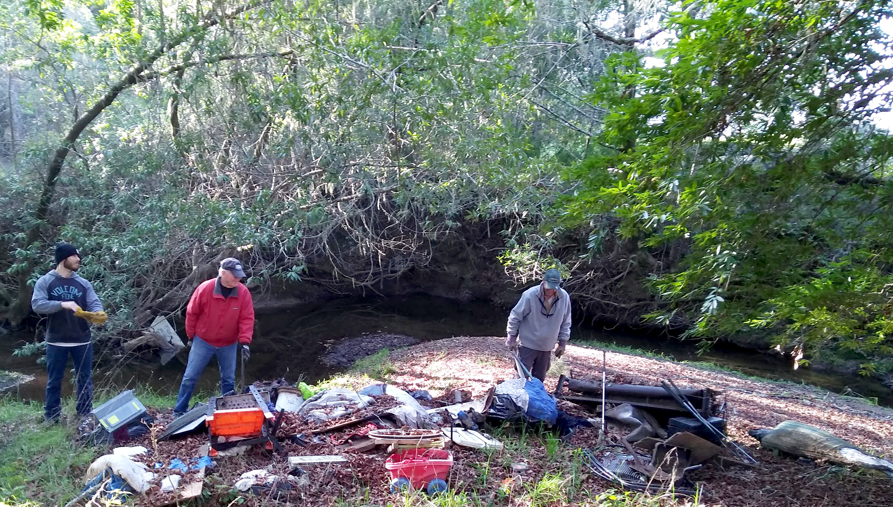 Staff and volunteers of the Salmon Protection and Watershed Network (SPAWN) removed garbage and debris from the remains of a camp in Lagunitas on Friday, Jan. 4 that would otherwise be carried downstream by forecasted storms. | Photo by Turtle Island Restoration Network